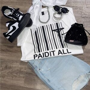 White Graphic Tee with Black Sneakers and Light Blue Denim Skirt
